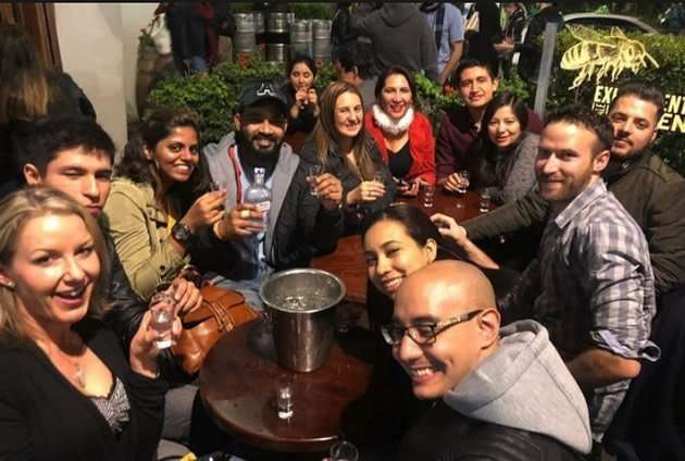 A group of tourists at a pub in Bogota, Columbis.