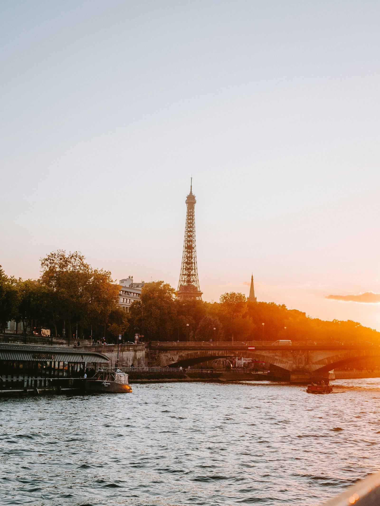 The Eiffel Tower over the Seine at sunset